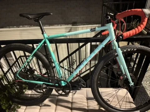 Aqua Fairdale Weekender Archer with red drop bar tape and a partially finished drivetrain rebuild.